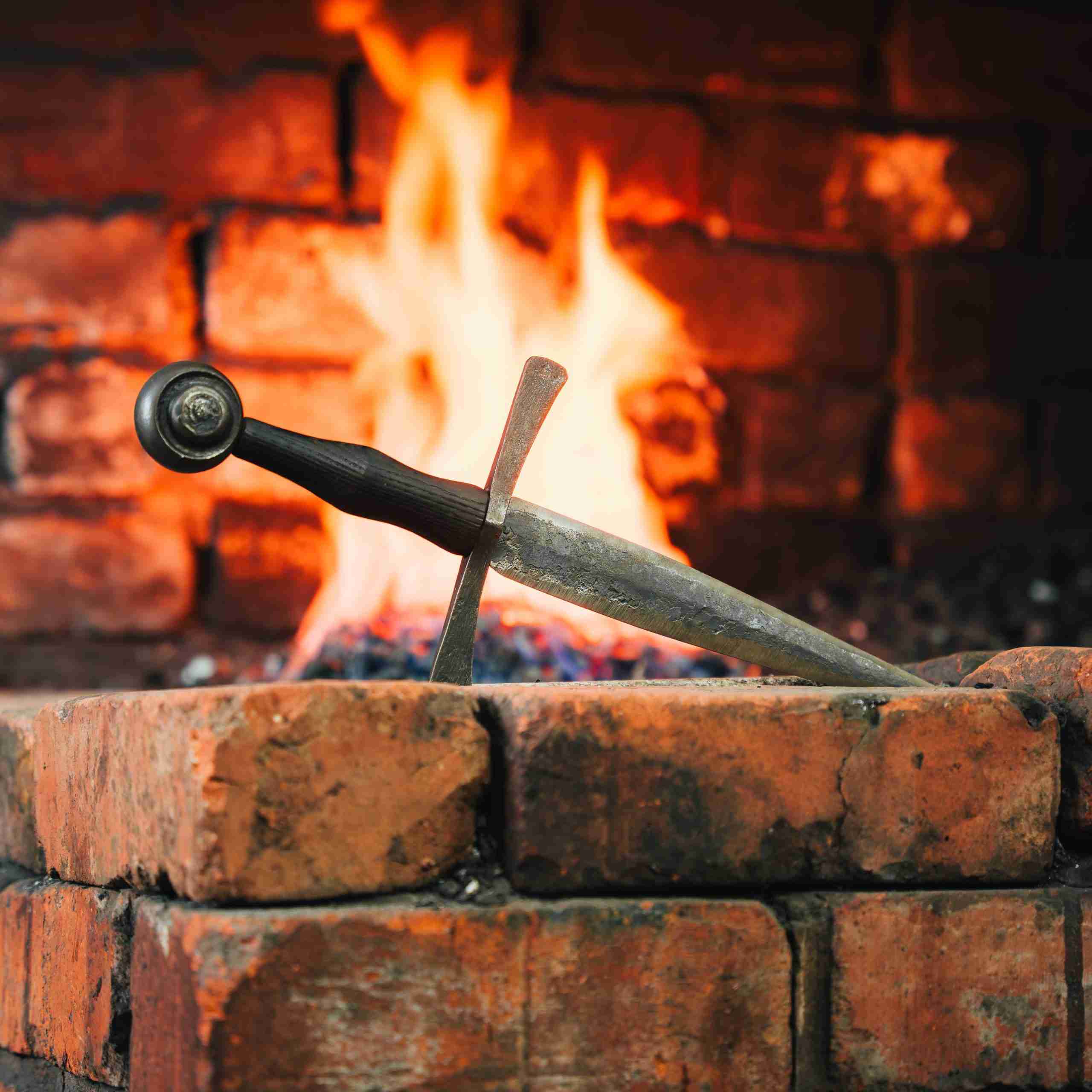 Dagger in front of fire